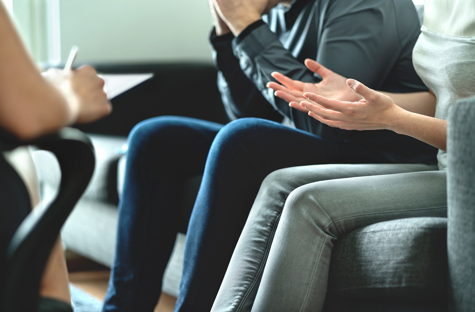 Angry Couple Argue In Therapy. Dispute In Marriage Counseling. C