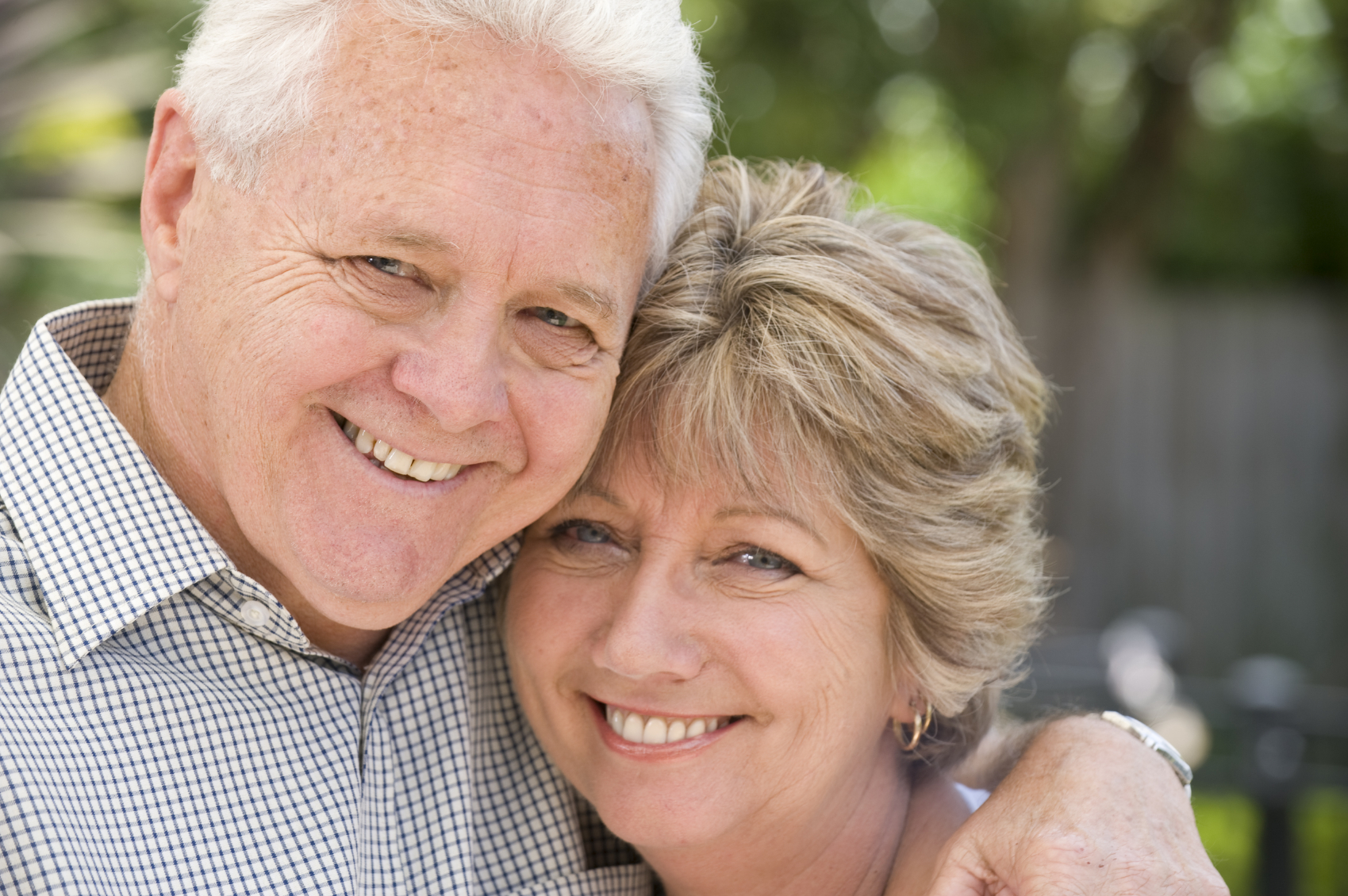 Senior couple smiling portrait outdoors depression counseling